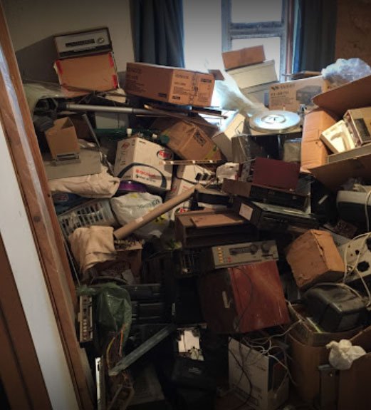 A room at a Birmingham residence stacked high with rubbish.